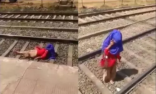 రైలు తనమీది నుంచి వెళ్లినా చలించని యువతి.. తీరిగ్గా పట్టాలపై కూర్చుని..