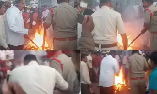 భోగిమంటల్ని బూటుకాలితో తన్నిన పోలీసులు