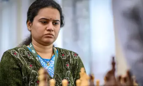 koneru hampi, championship,  world rapid and britz chess championship,  rare record.