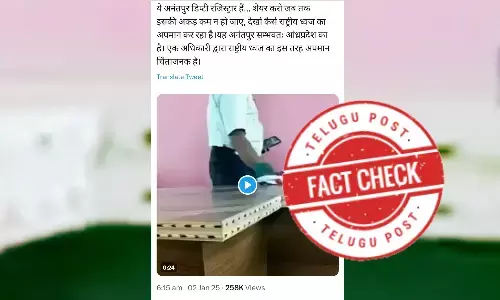 The person cleaning a table with the national flag is not a Deputy Registrar from Anantapur, Andhra Pradesh