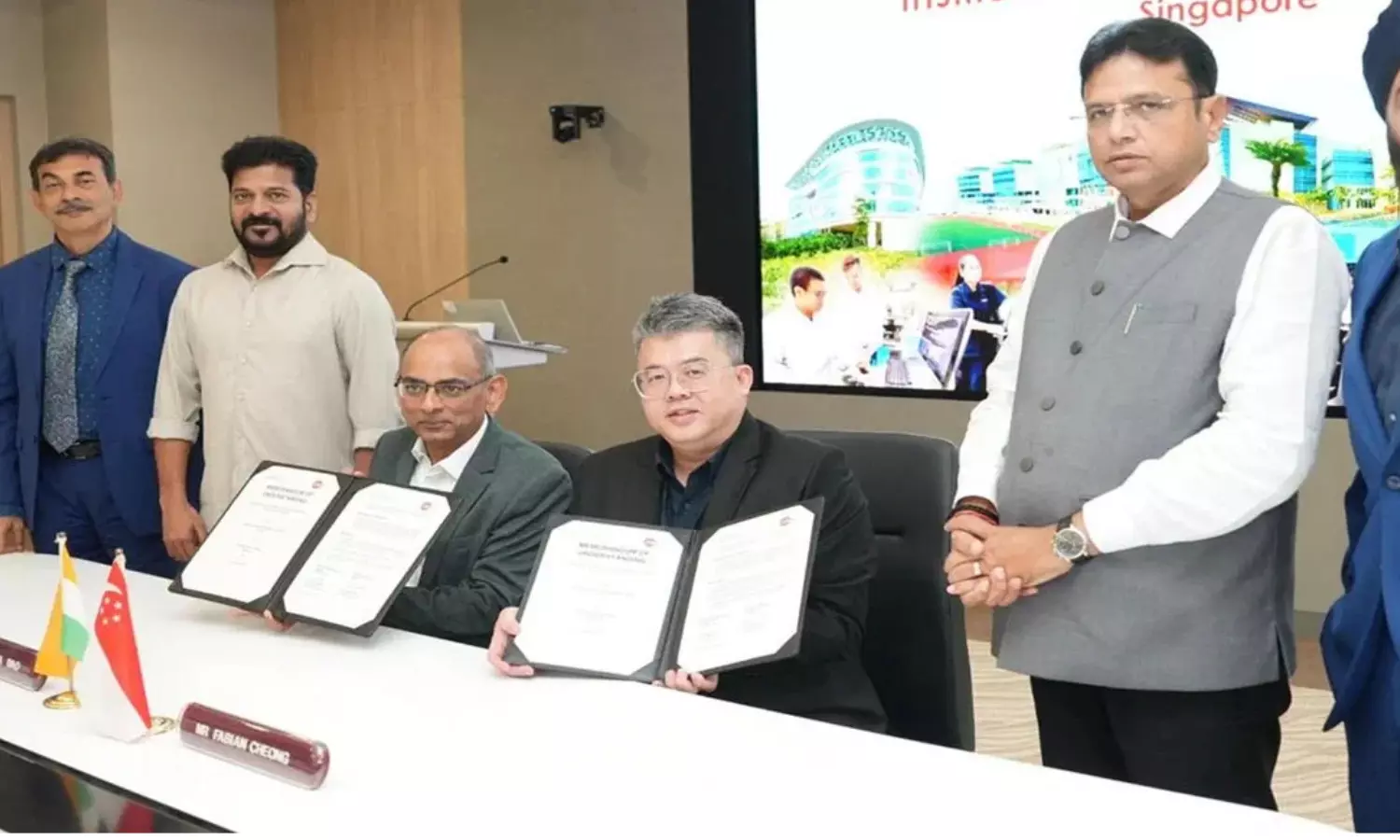 revanth reddy,  chief minister, first day, singapore