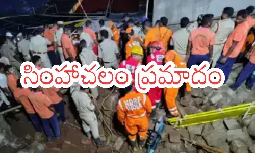 seven officials, suspended,  wall collapsed, simhachalam chandanotsavam
