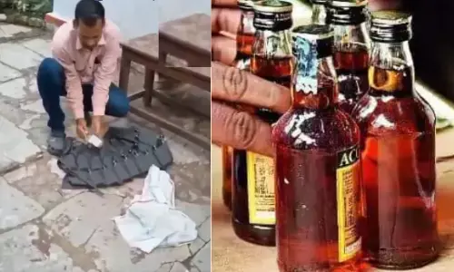 అదో రహస్య జేబు.. 24 మద్యం సీసాలు దాచేశాడు