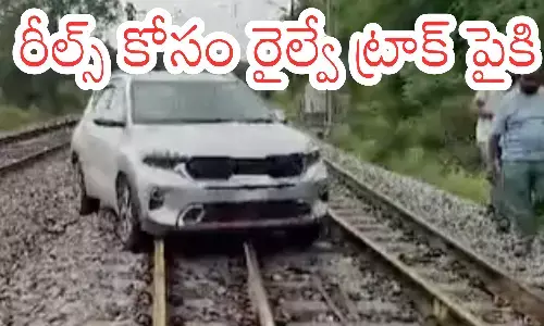 young woman, sensation, car on the railway track, shankarpalli