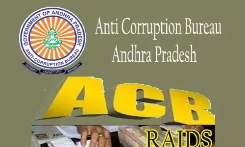 anti-corruption bureau, conducted raids , two top officials,  andhra pradesh