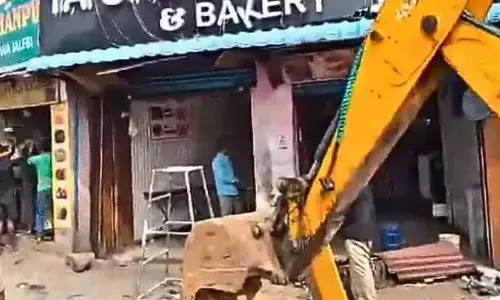 ghmc official, removing shops, nampally-ahmednagar,, hyderabad