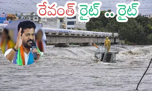looded Hyderabad streets with Musi river overflowing after heavy rains.