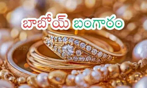 Gold jewelry displayed in a shop during price hike in India.