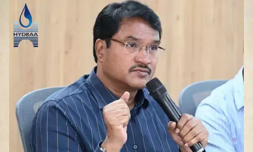 HYDRAA teams removing illegal land encroachments in Hyderabad during lake restoration drive