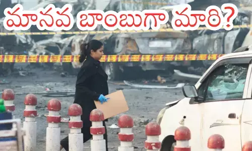 Red Fort car blast site Delhi, NIA officers inspecting wreckage