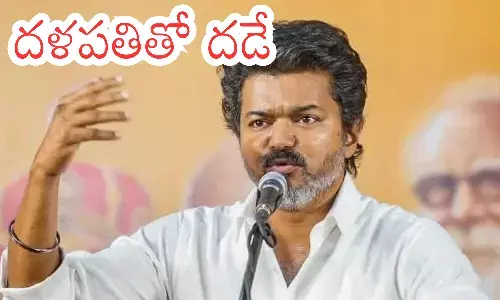 Vijay addressing a controlled indoor meeting in Kancheepuram during his Vijay Kancheepuram speech.