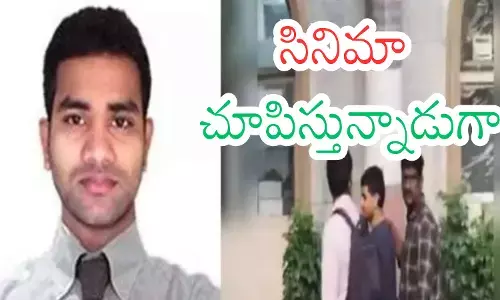 Police officers escort iBomma Ravi during the ongoing probe into the piracy investigation. Police officers escort iBomma Ravi during the ongoing probe into the piracy investigation.