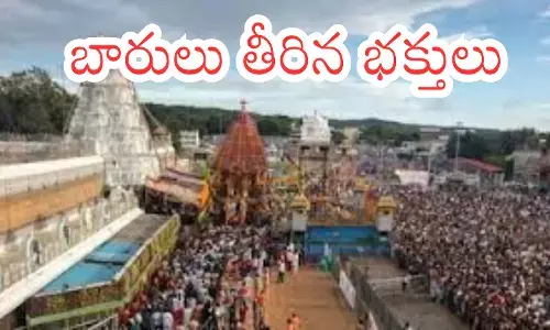 rush of devotees continues in tirumala today