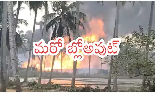 Flames rising from the ONGC gas pipeline blast site in Konaseema with fire rescue teams in action