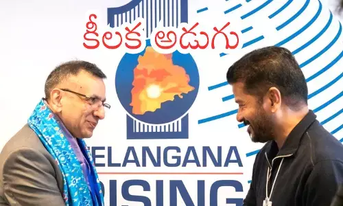 Revanth Reddy meeting Google APAC president Sanjay Gupta at WEF Summit