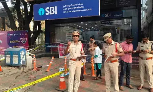 police are searching for the suspects in the shooting incident at kothi sbi in hyderabad