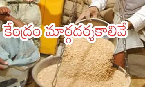 Beneficiaries completing ration card e-KYC using Aadhaar authentication at a fair price shop in India.