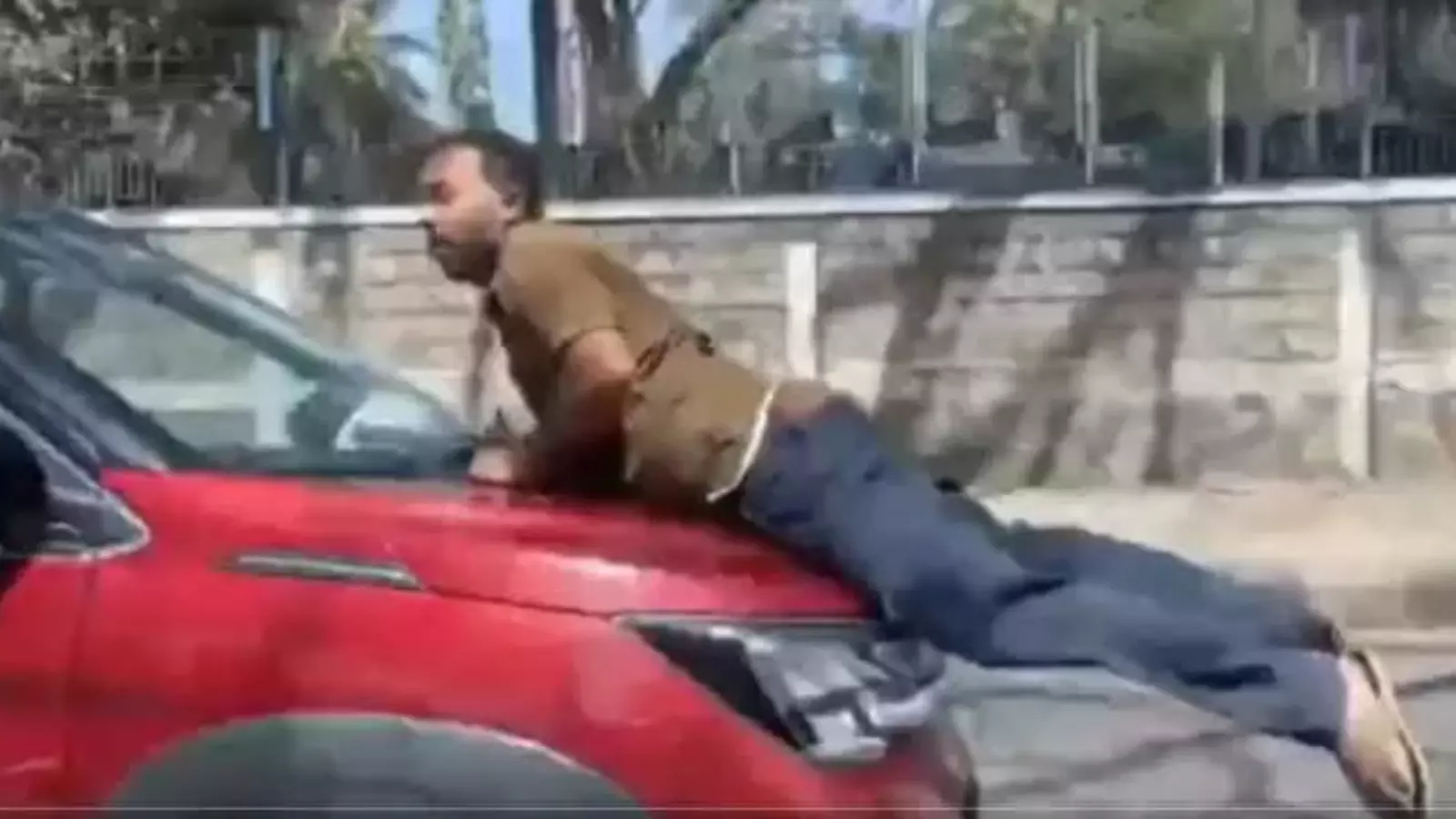 car hit a two-wheeler rider and dragged him a kilometer away still on the bonnet in bengaluru