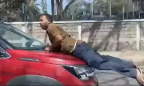 car hit a two-wheeler rider and dragged him a kilometer away still on the bonnet in bengaluru