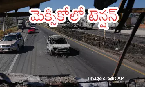 Mexican security forces patrol streets after El Mencho killing amid cartel violence in Jalisco.