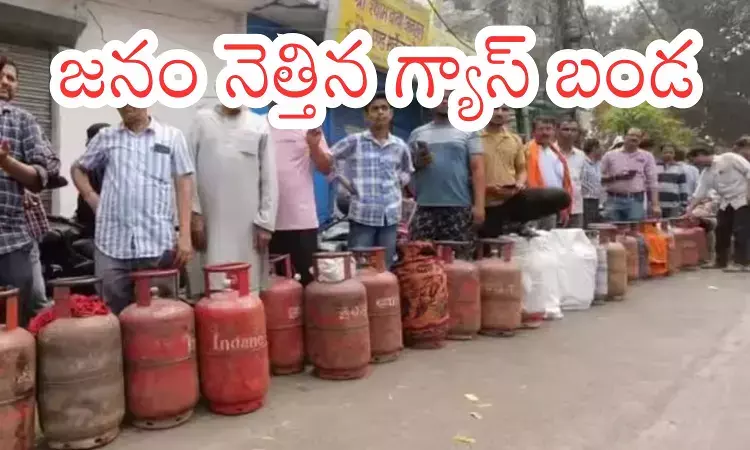 People waiting in line outside a gas agency as LPG cylinder black market complaints rise in Andhra Pradesh and Telangana
