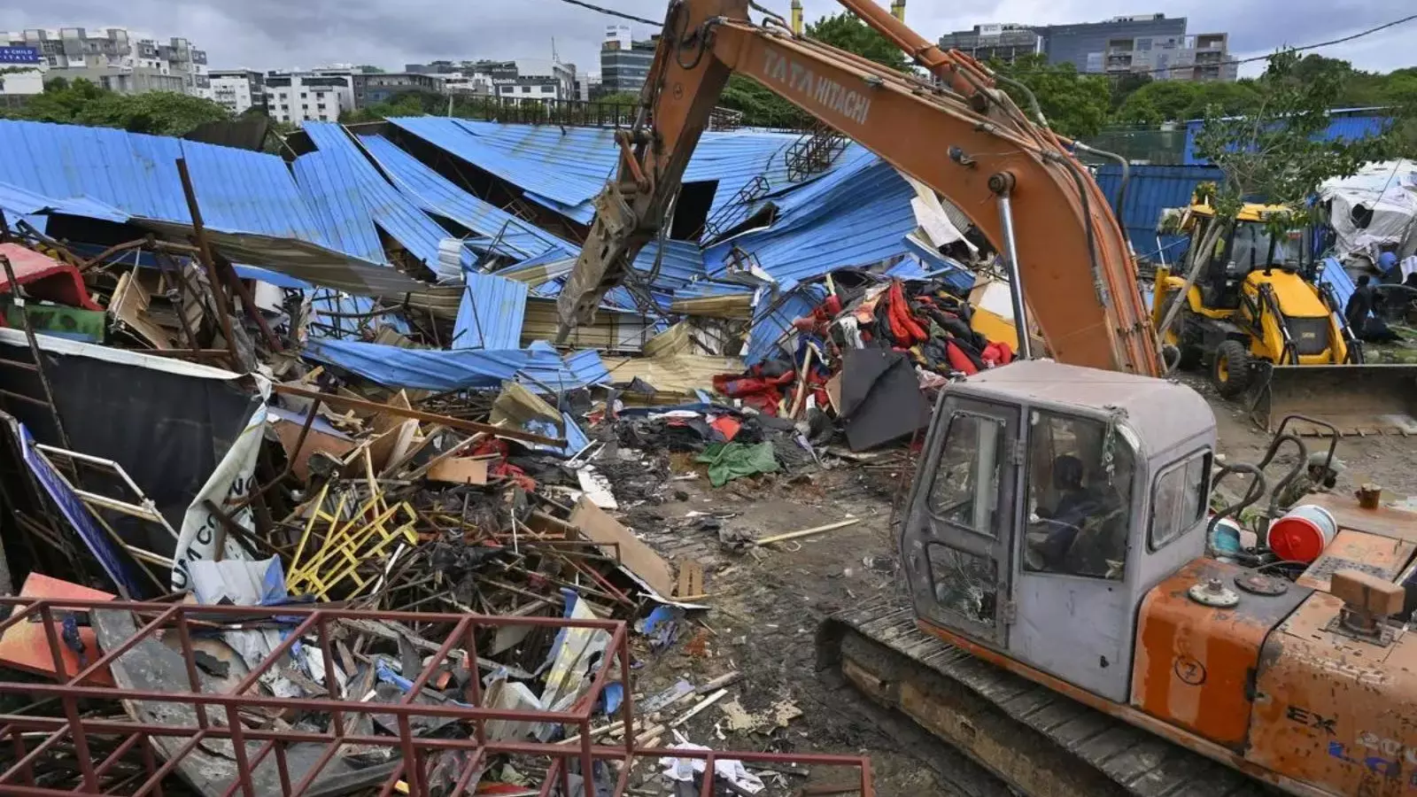 hydra officials seize encroached land in attapur, hyderabad hydra officials seize encroached land in attapur, hyderabad