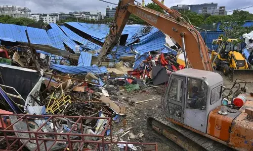 hydra officials seize encroached land in attapur, hyderabad hydra officials seize encroached land in attapur, hyderabad