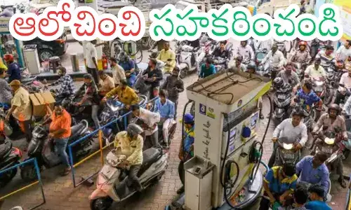 People standing in long queues at a petrol bunk in Hyderabad amid petrol shortage concerns.