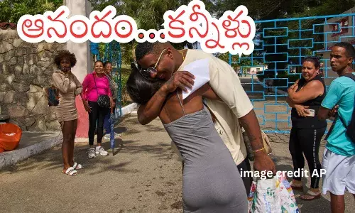 Families hugging released prisoners outside La Lima prison in Havana