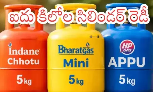 5 kg small LPG cylinders displayed at a kirana store for easy consumer purchase. 5 kg small LPG cylinders displayed at a kirana store for easy consumer purchase.
