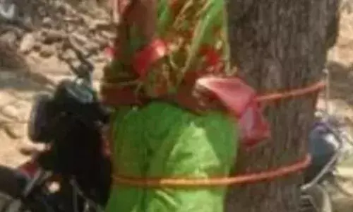 anganwadi teacher was tied to a tree by the lenders for not repaying the loan