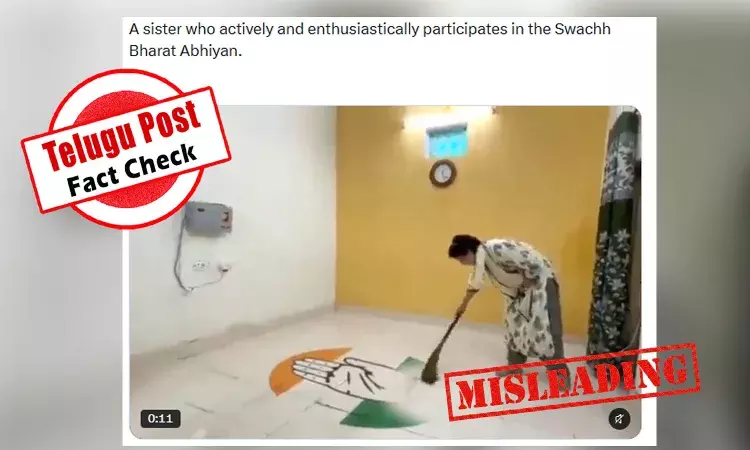 Priyanka Gandhi sweeping away a design bearing the Congress party logo Priyanka Gandhi sweeping away a design bearing the Congress party logo